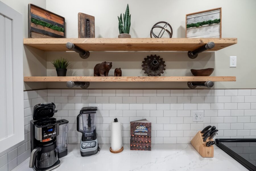 Duluth Rental Suite 102 - Full kitchen with artwork and subway tile backsplash