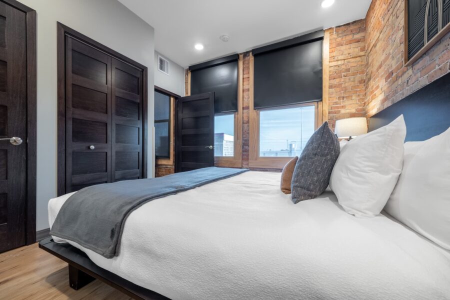 Duluth Rental Suite 201 - Bedroom with two large windows and view