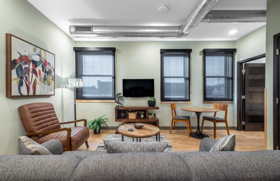 Duluth Rental Suite 202 - Living area with Three large windows, hardwood floors, designer furniture
