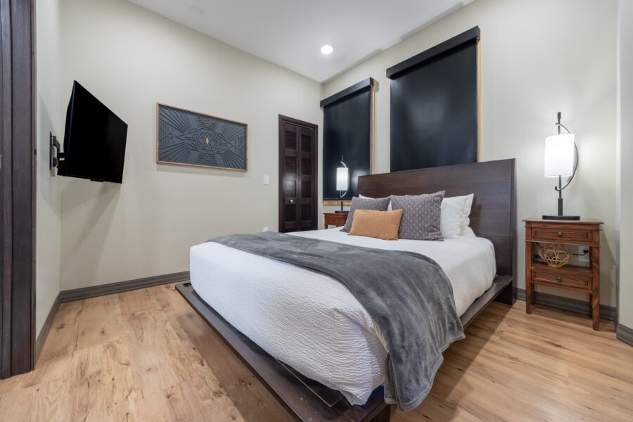 Duluth Rental Suite 203 - King bedroom with television, hardwood floors