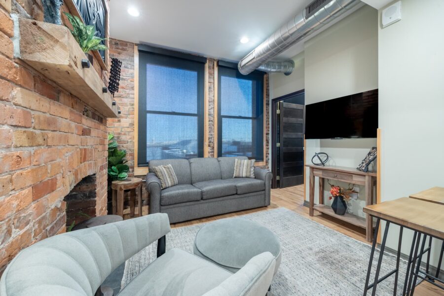 Duluth Rental Suite 301 - Living space with fireplace and large windows with view